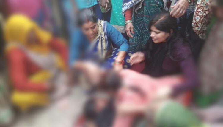 A woman was killed by a truck after a bicycle hit her.