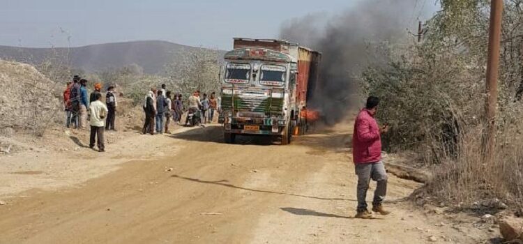 Fire in the truck due to eleven thousand high tension wire, narrowly escaped driver and driver