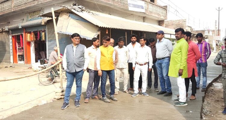 Aid engineer and executive officer inspect the road under construction