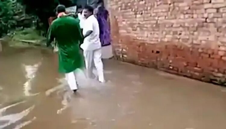 UP: Villagers make MLA walk in sewer water accumulated on the road, video goes viral on social media