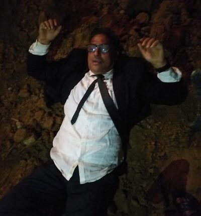 Additional District Judge lying in front of JCB