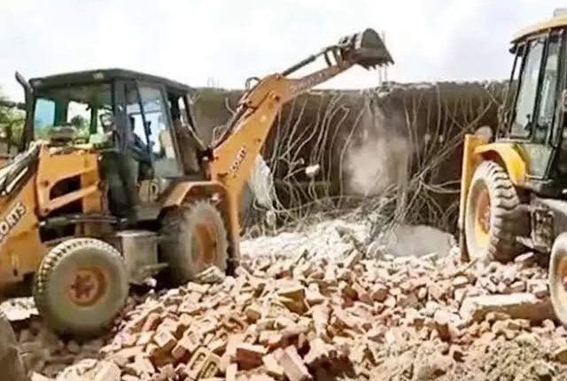 Bulldozer running on wrongly bought land