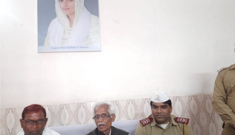 Officials of Nirankari Mission talking