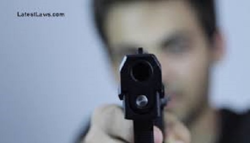 During the hearing in the court the bullies pointed the gun at the advocate