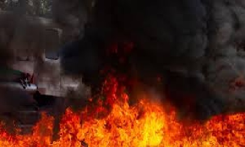 Two trucks carrying construction material set on fire in Manipur